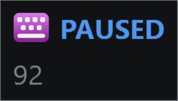 The panel showing KeyPressOSD's icon and a PAUSED marker on one line